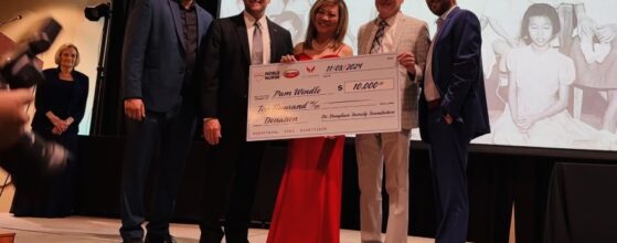 Pamela Windle (center) receive a $10,000 check as the winner of the Noble Nurse of the Year award. Photo courtesy of Mike Calvert Toyota.